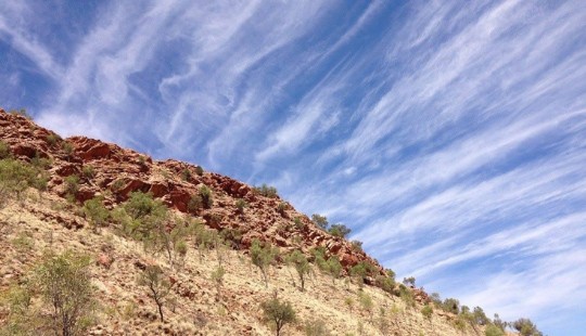 Mountain and cirrus clouds on a blue sky