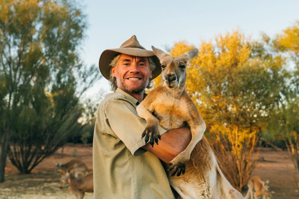Alice Springs man carrying a kangaroo