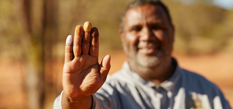 Aboriginal man with hand out
