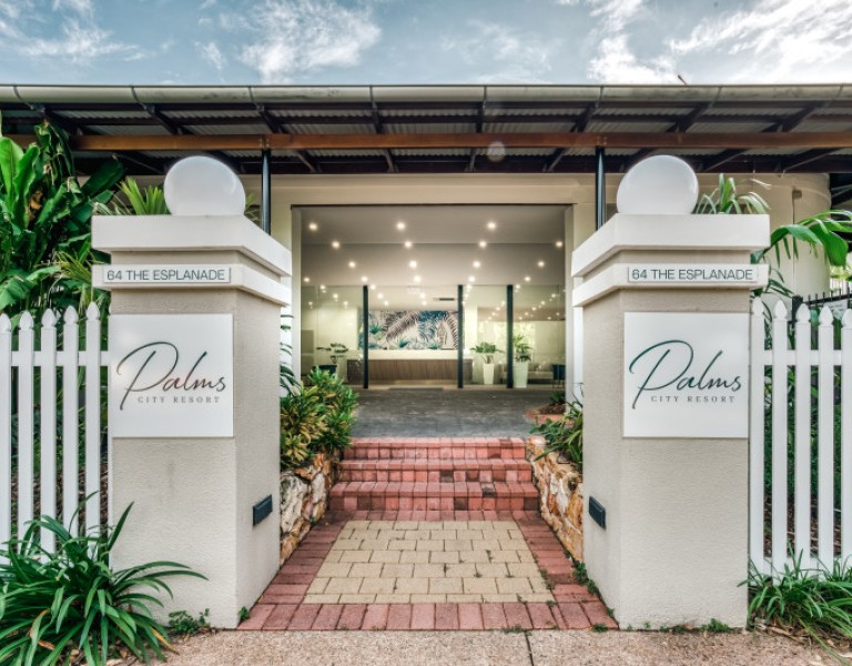 The entrance to Palms City Resort