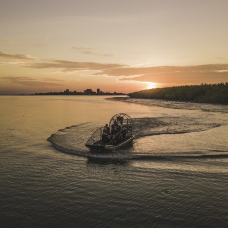 Airboat on Darwin Harbour with sunset in background 