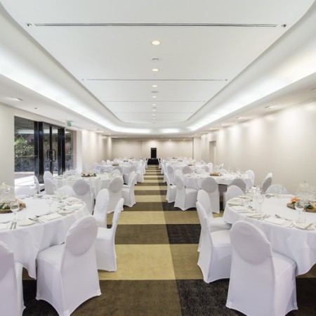 Function room with set dining tables at DoubleTree Hilton Darwin