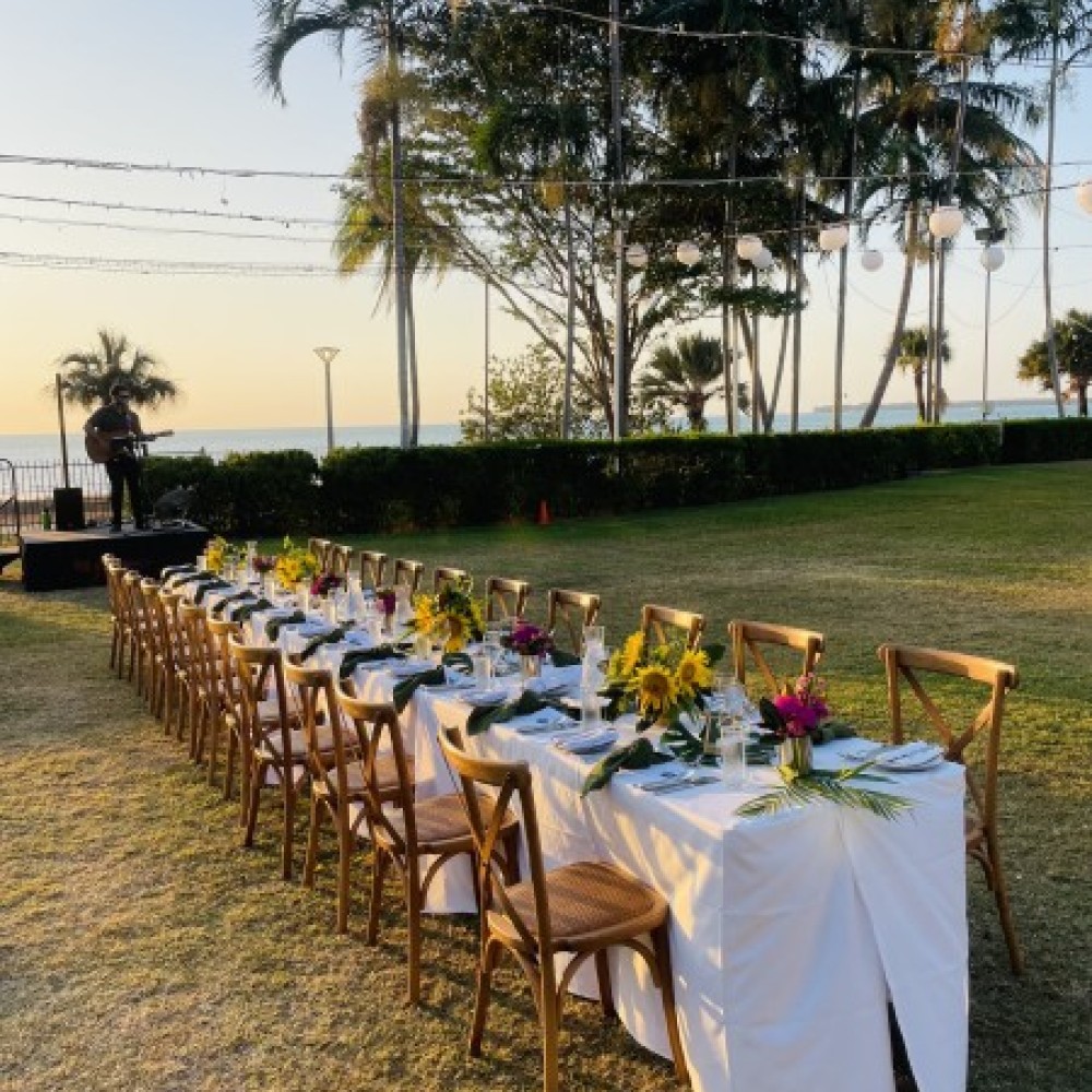 Outdoor event with set dining table 